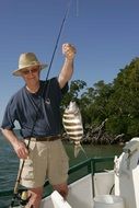 happy fisherman caught fish