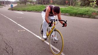 man riding sport bike on road