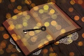 bokeh vintage key on open book