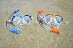 masks for swimming are on the sand