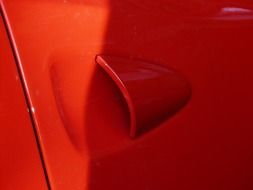 air intake on a red car