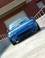 blue sports car mazda