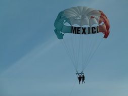 parachute in the sky with the inscription mexico