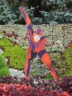 skater, statue on flowerbed in park