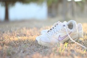 white sneakers for fitness on the ground