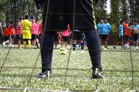 legs in the football goal
