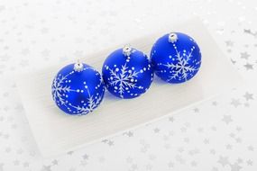 three blue Christmas balls