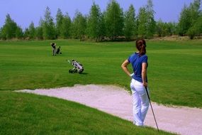 women golfer in white pants