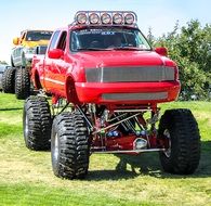 High truck on the grass on a sunny day
