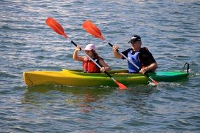 people in canoes on the lake