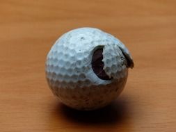 damaged golf ball on the table