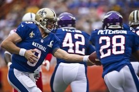 football players in blue uniform