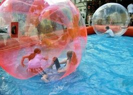 Inflatable balls on a pool