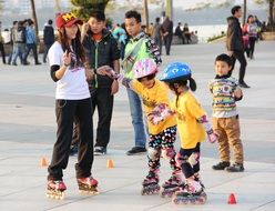 children rollerblading in the street