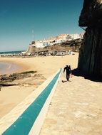 Picture of surfer is on a beach