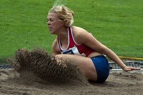 girl doing a long jump