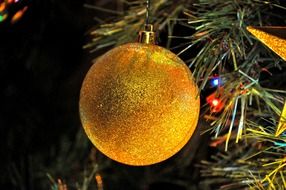 yellow ball on christmas tree