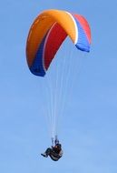 skydiver in blue sky