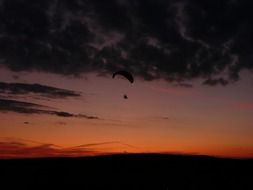 flight glider on sunset background