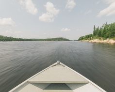 front of the boat on the lake