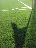 Shadow on a Green football field