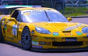 yellow racing car under the bright sun