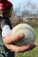 baseball ball in hand closeup