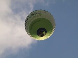 green hot air balloon in the sky