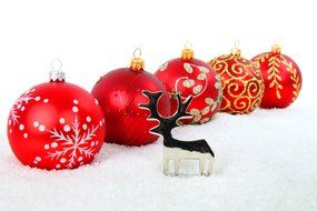 figure of a deer near Christmas balls