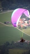 pink paraglider in the sky