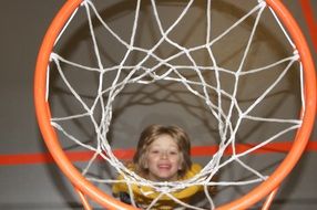 child under the basketball ring
