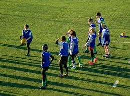 children rugby team on lawn