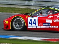 red race car with number