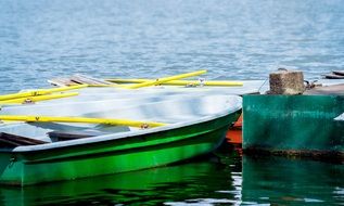 paddle boats on water at pier