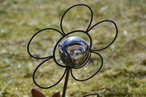 garden decoration with a metal ball