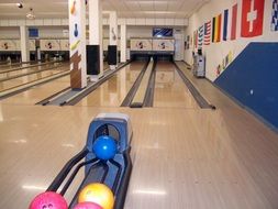 bowling alley with colorful balls