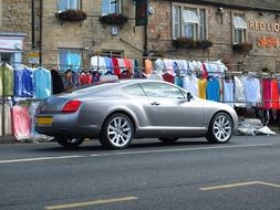 silver grey car on a city street