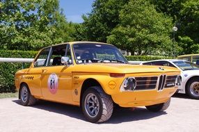 yellow retro sport car under the bright sun