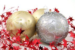 multicolored christmas balls with a pattern near the stars