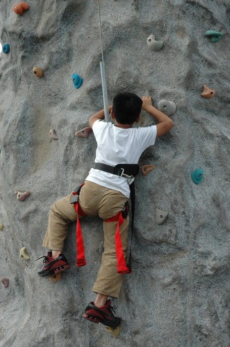 Climber on a training rock