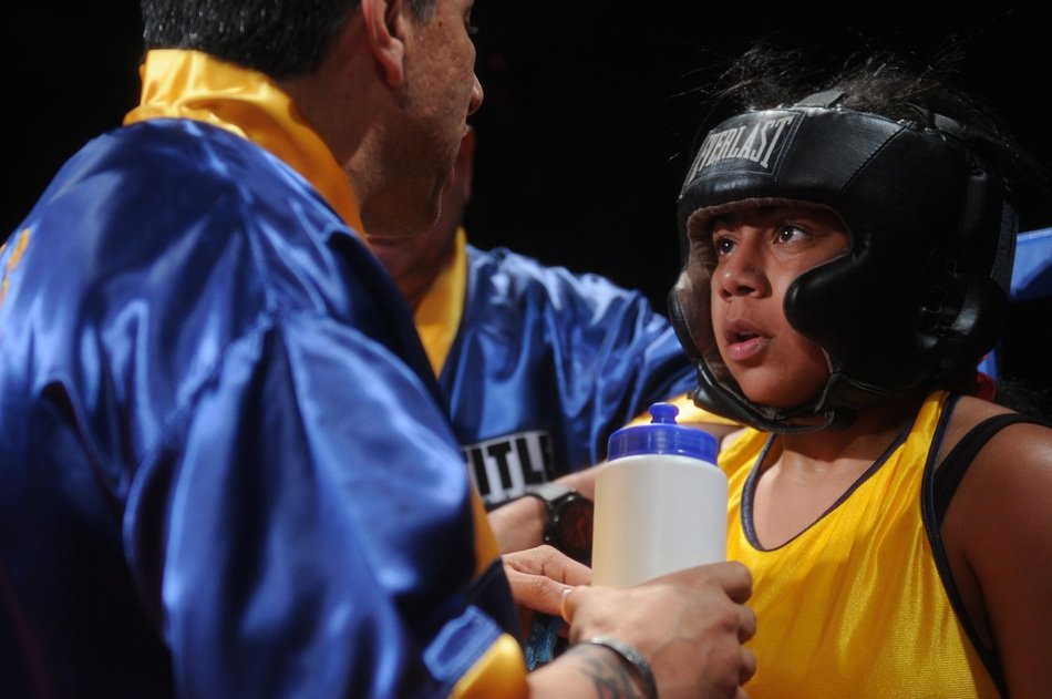coach and boxer in the ring