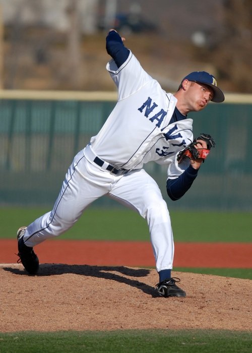 baseball pitcher is throwing the ball