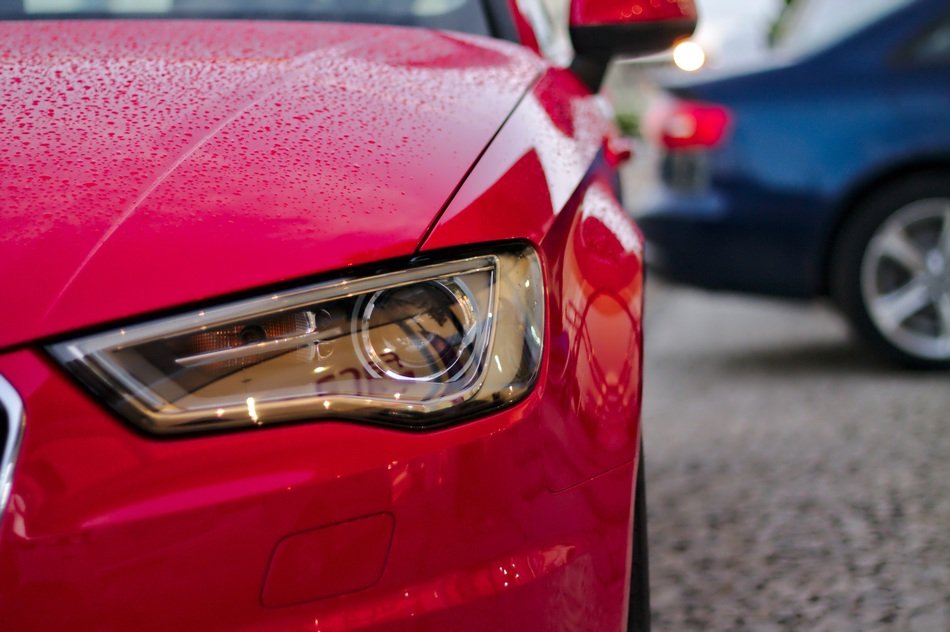 red Audi in the rain close-up