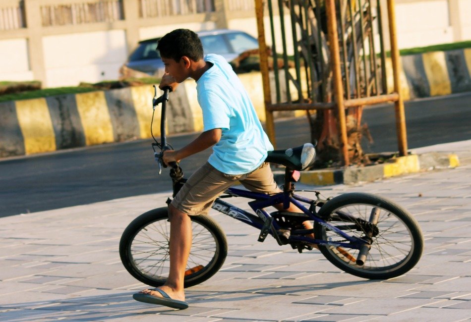 child cycling in the street