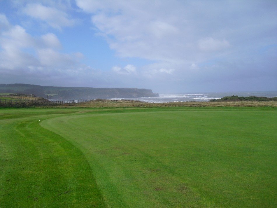 panoramic view of a golf course in scotland