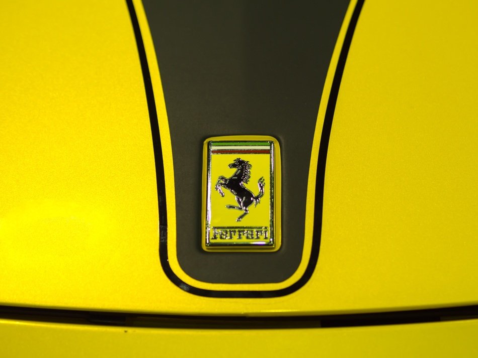 Ferrari sign on the hood of a car