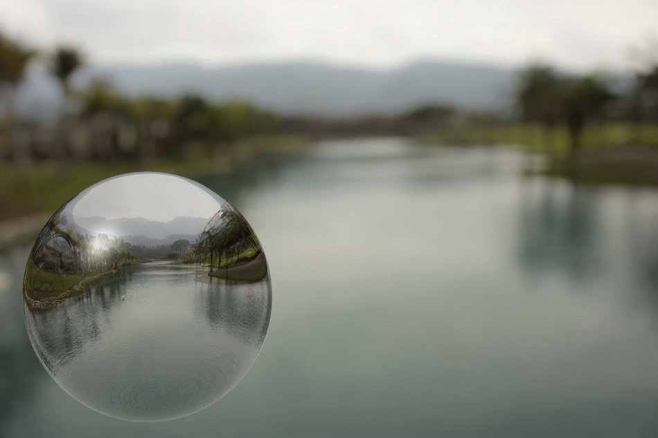 crystal ball on the background of the river