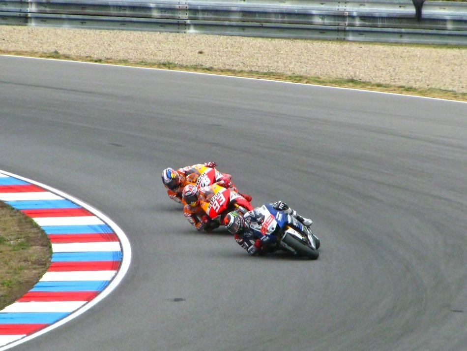 motorcyclists drive on the bend