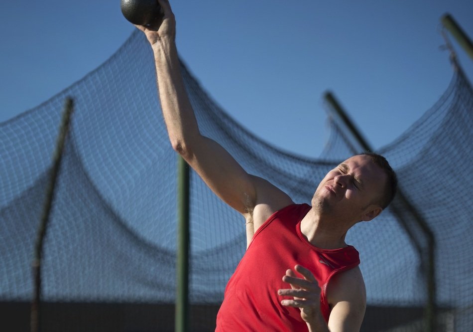 The athlete throws the core