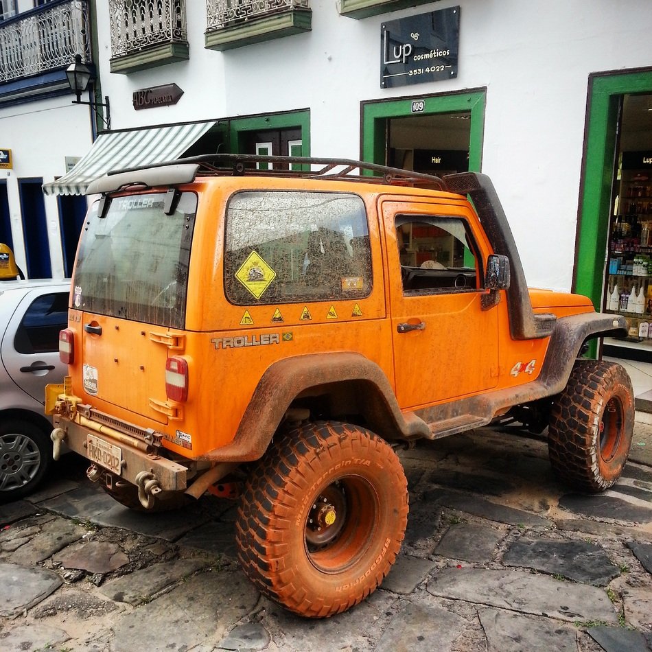 Big orange jeep near the house